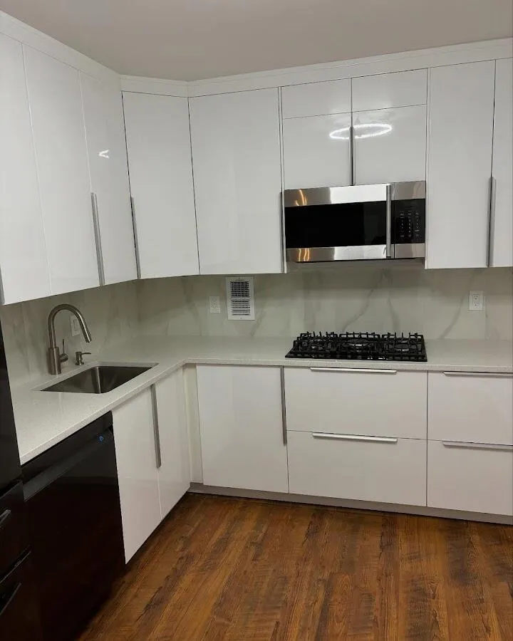 Restored kitchen with white cabinets after water damage in Bloomfield